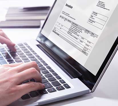 image of an invoice on a laptop screen